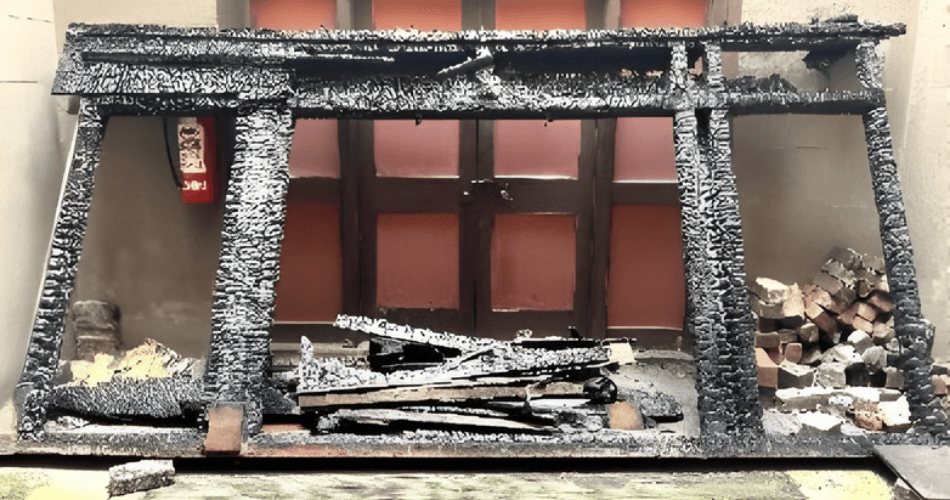 The destroyed Heavenly Well skylight of the See Yup Temple, showing burnt framing and collapsed timber