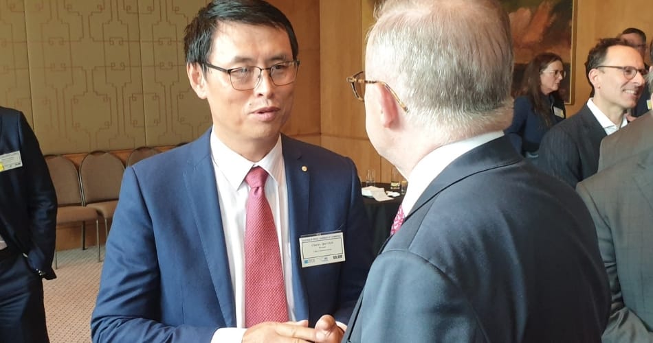 A CHIN Communications specialist providing high-level diplomatic and government interpreting during an executive presentation